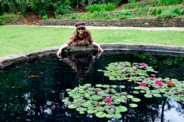 Karen Duquette playing in the Iris Garden pond